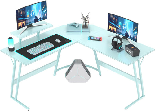 L shaped gaming desk with dual monitors, gaming accessories, carbon fiber surface, perfect for gamers and home offices.