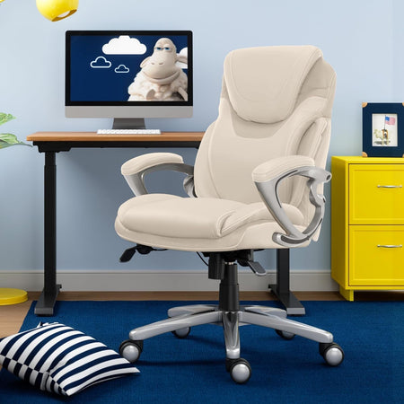 Stylish white ergonomic office chair in modern workspace with a computer and decor, representing top office chairs on the market.